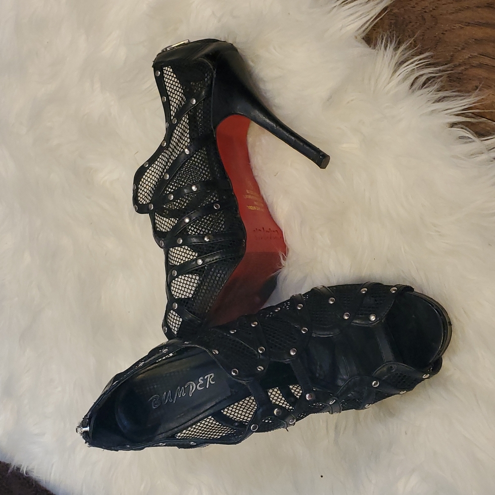Red bumper bottoms black net heels.